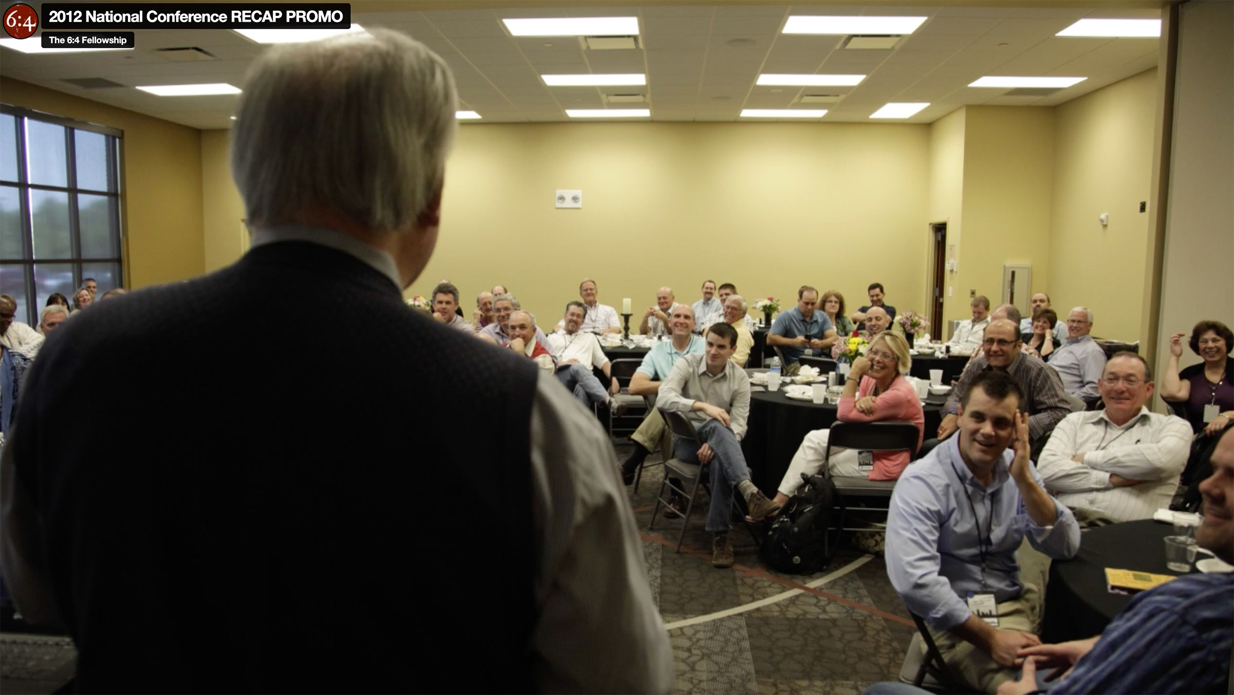 Speaker addressing audience at conference