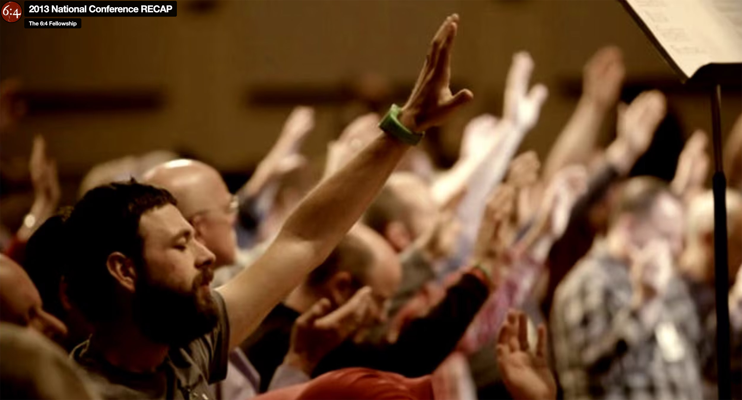 Audience raising hands at 2013 National Conference.