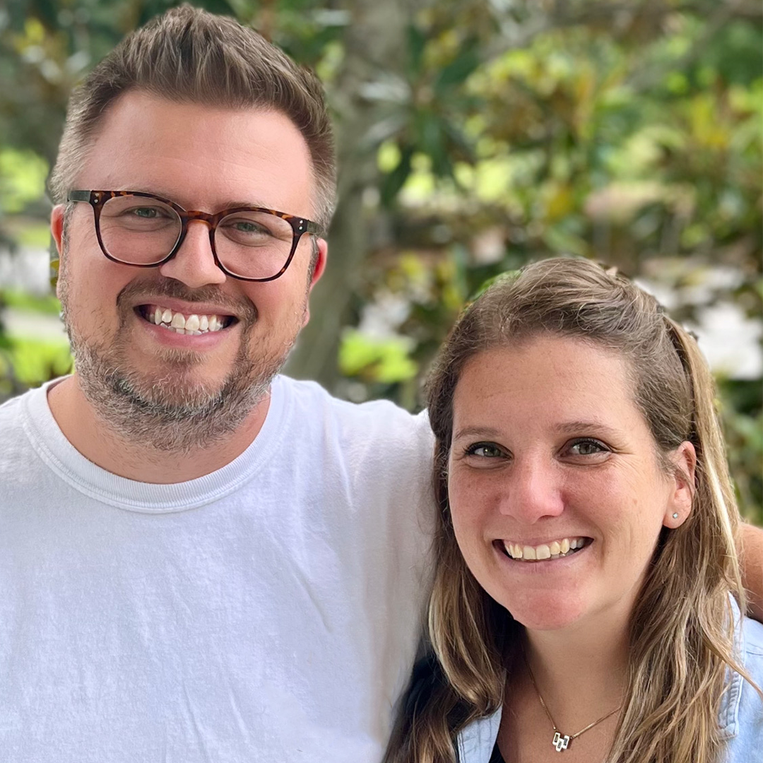 Two people smiling outdoors