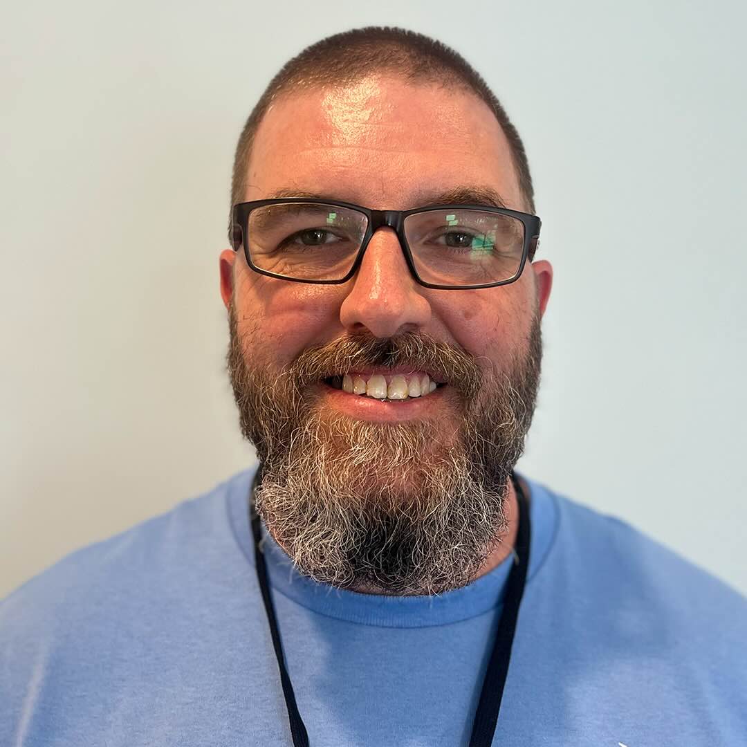 Smiling man with glasses and beard