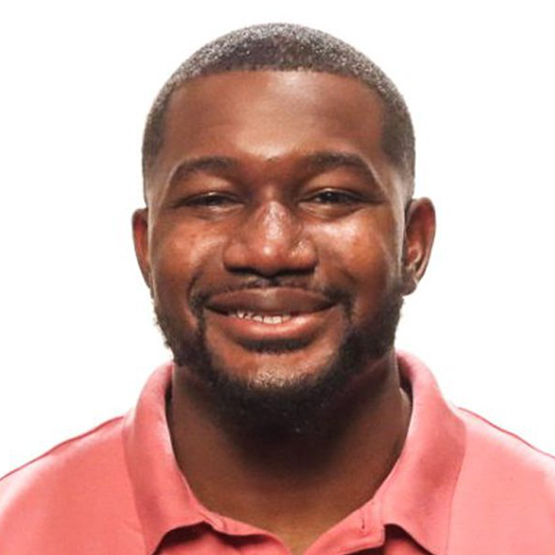 Smiling man in a pink shirt