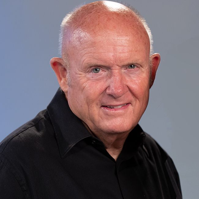 Man in black shirt smiling