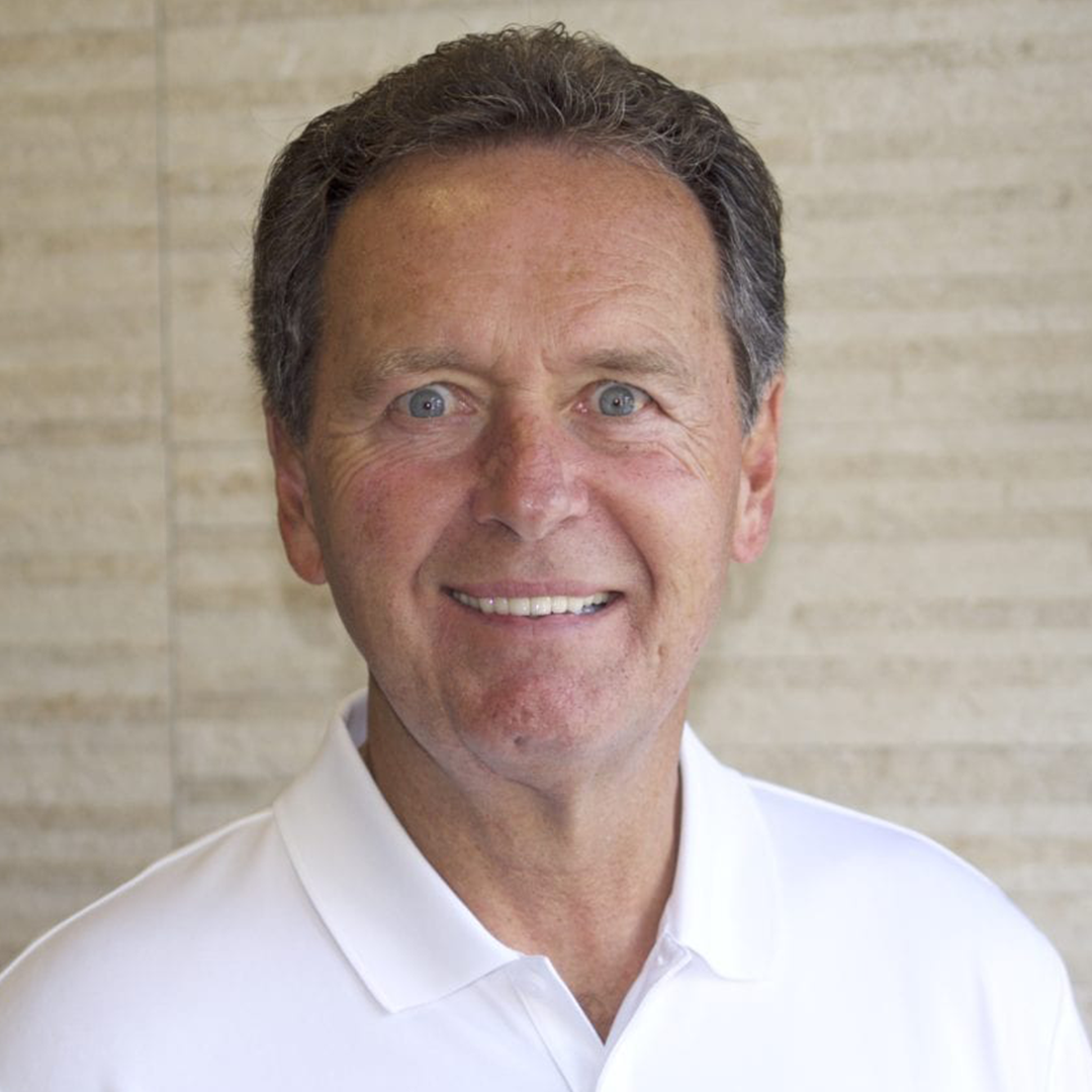 Smiling man in white shirt