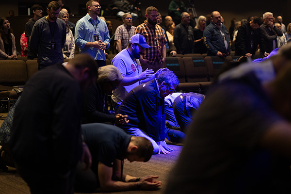 resilience crowd praying men on face